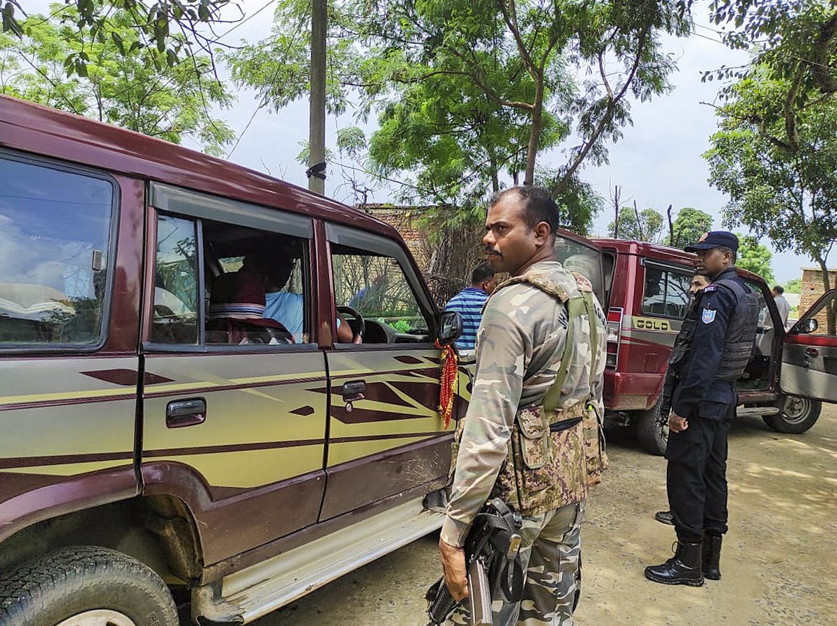 PTI : Security personnel outside the residence of a man allegedly linked to Al Qaeda, in Lohardaga district, Thursday, Aug. 22, 2024